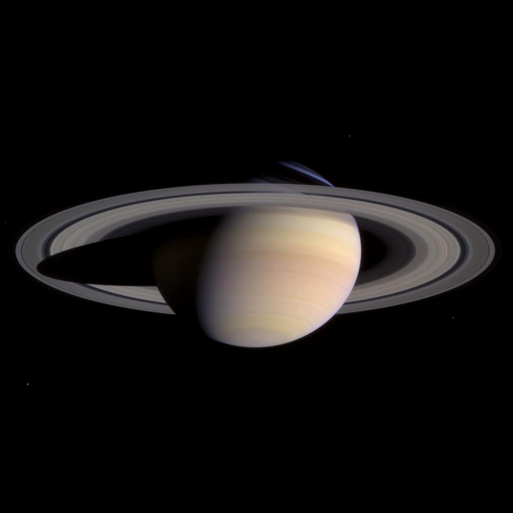 A view of Saturn and its rings set against the blackness of space.